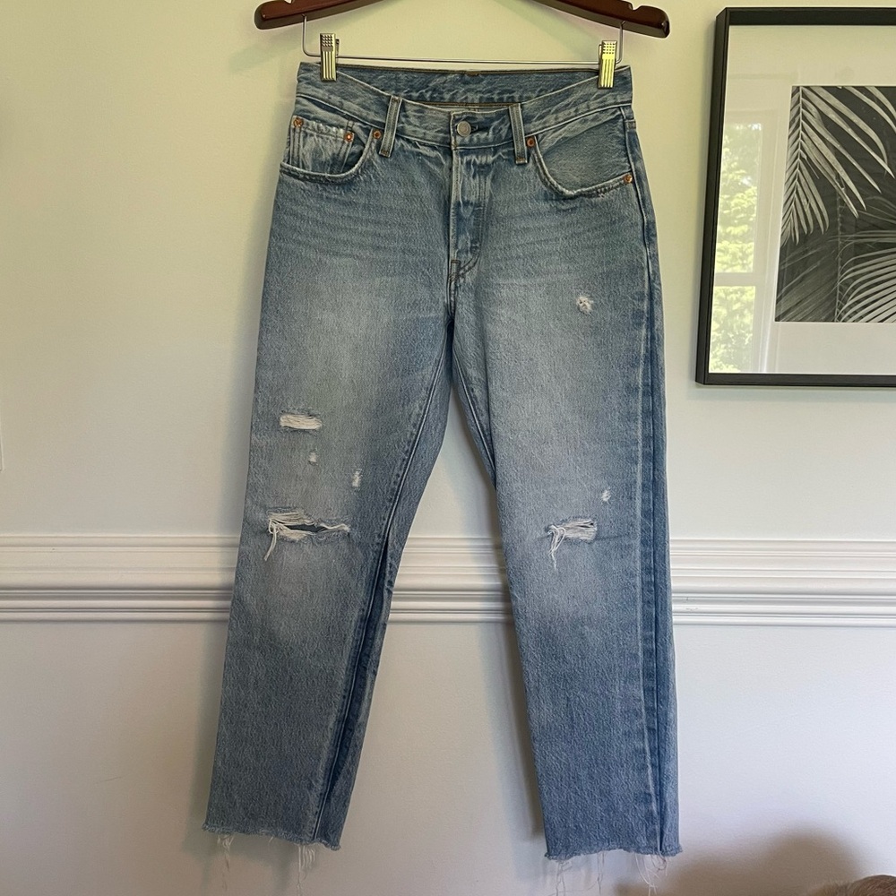 Levi’s 501 lightly distressed jeans